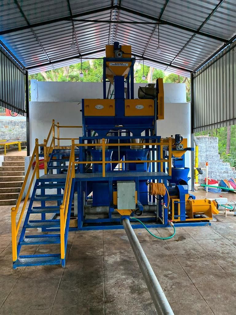 The estate's pulping and wet-milling equipment under a covered shed at Ratnagiri Estate